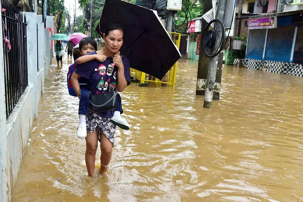 | Photo: PTI : Weather: Waterlogging after rain in Assam